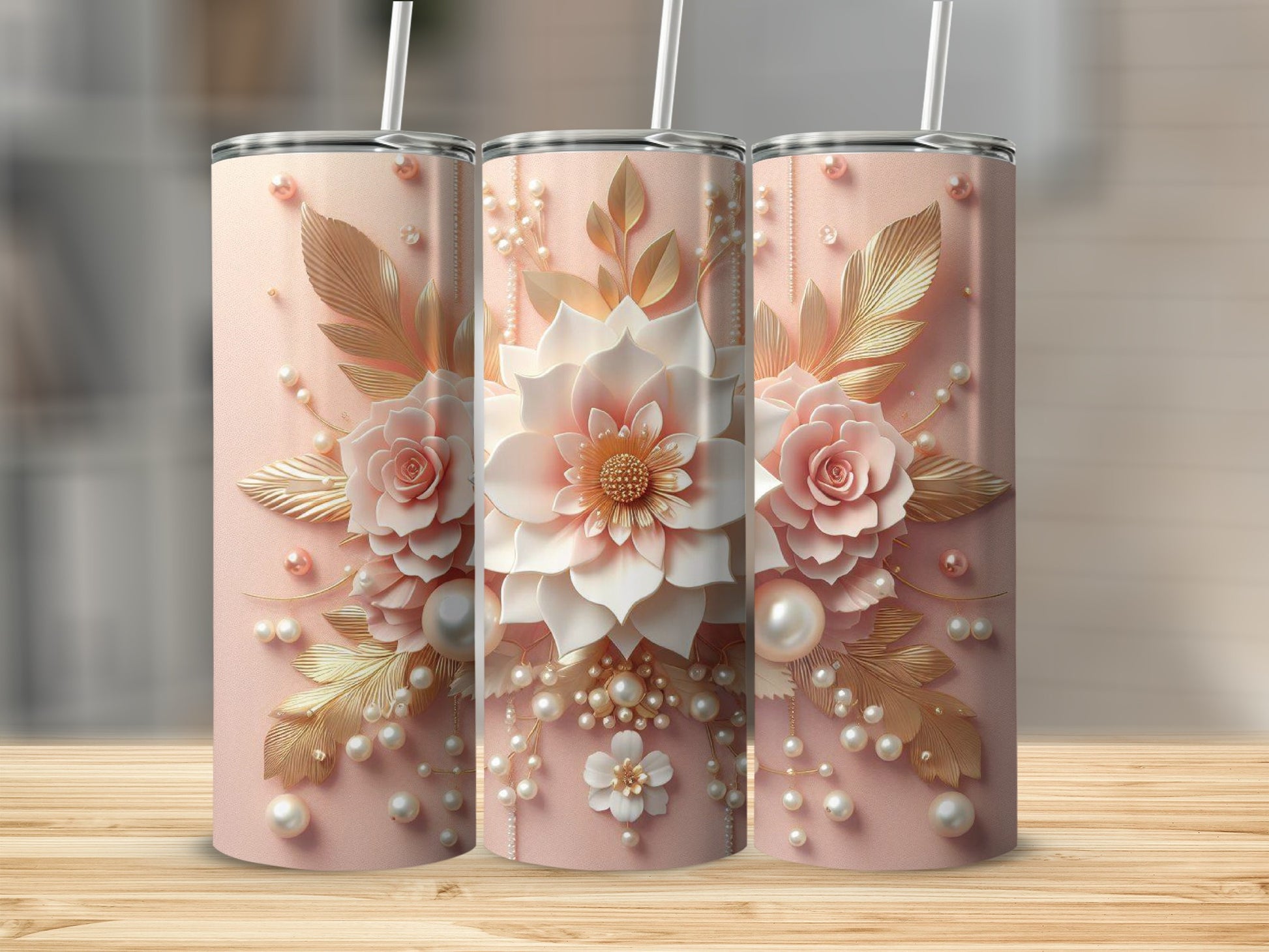 Three tall pink tumblers with floral and pearl embellishments.