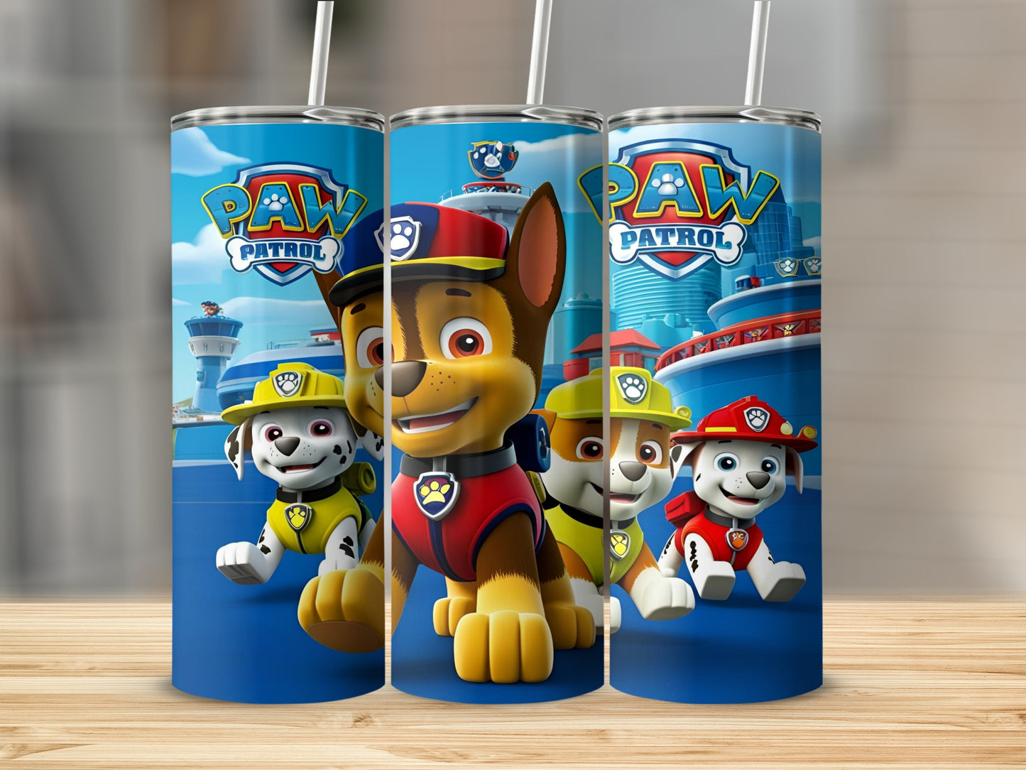 Paw Patrol characters Chase, Marshall, and Rubble on a blue tumbler.