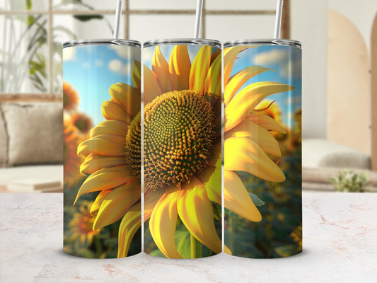 Sunflower design on three tumblers with a blurred field of sunflowers in the background.