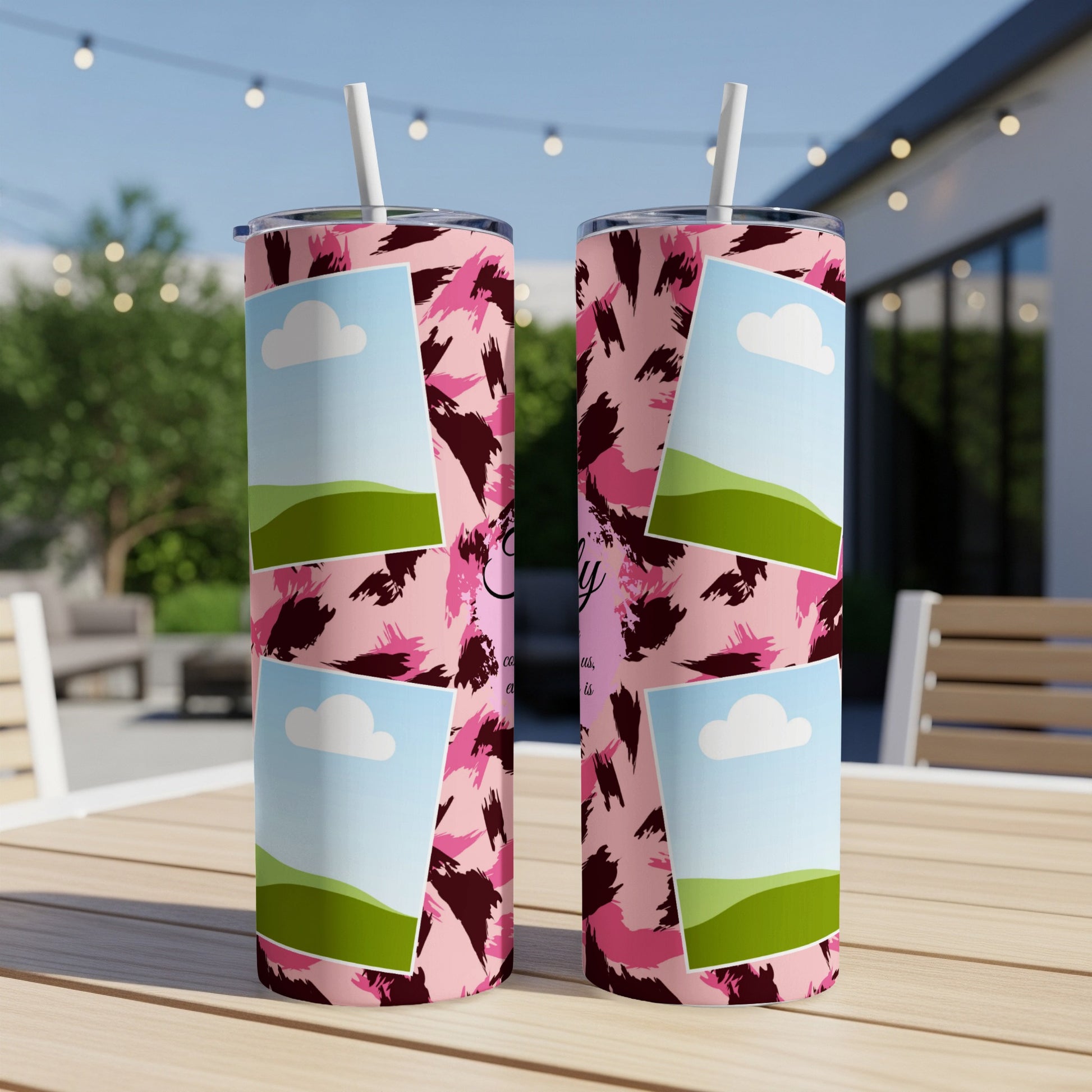Two tumblers with pink leopard print and photo frames sit on a table.