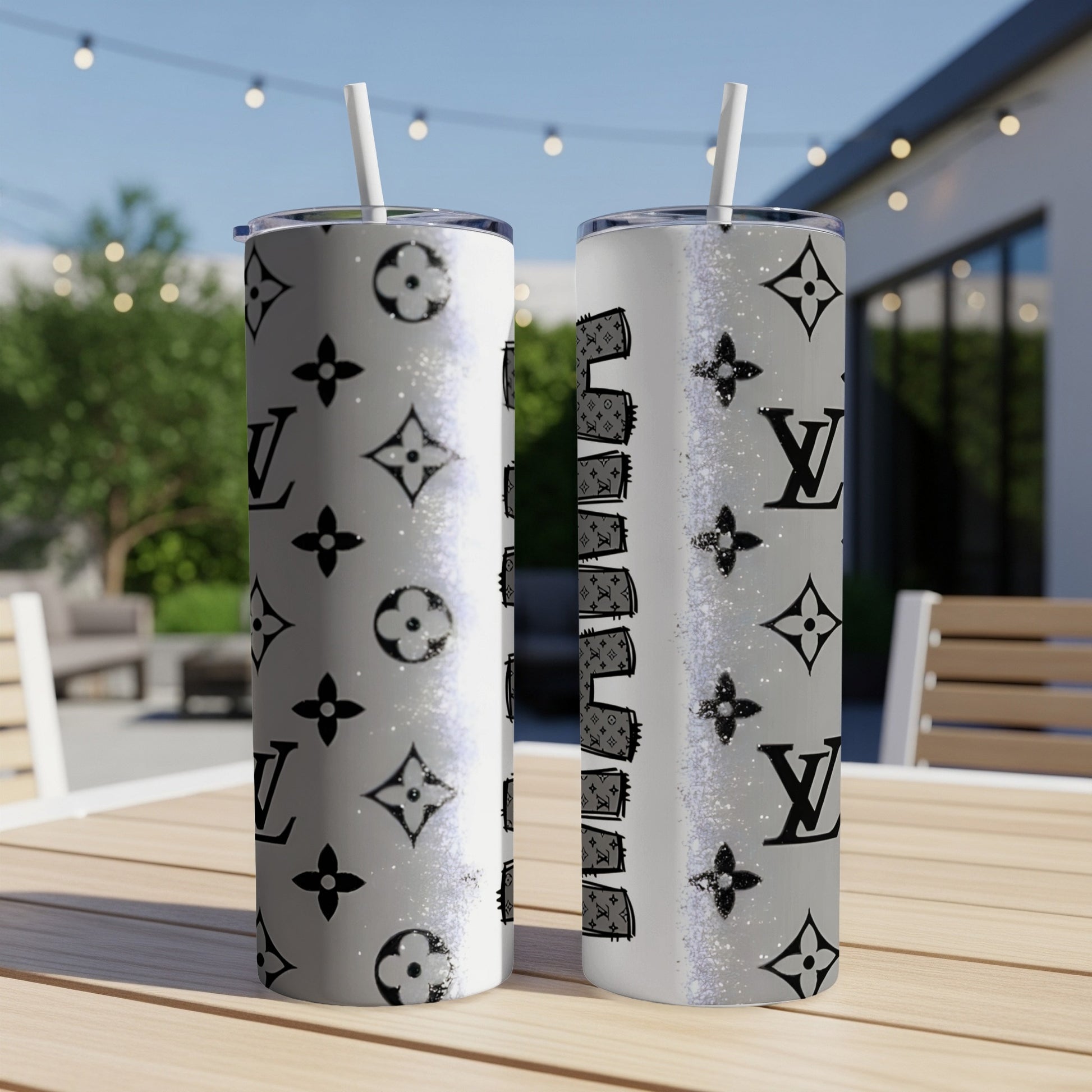 Two tumblers with LV monogram pattern and glitter accents.