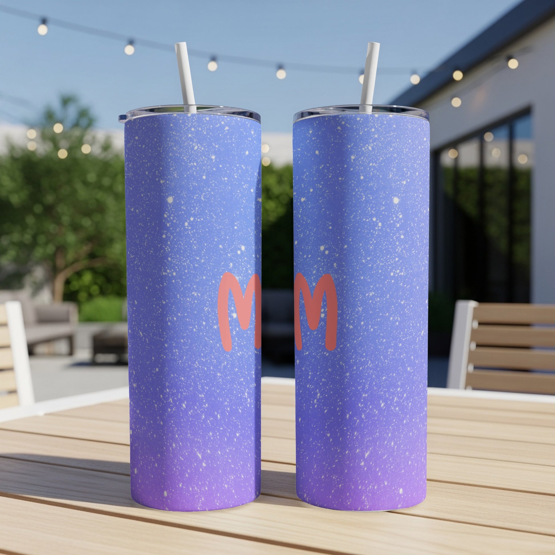 Two purple and blue gradient tumblers with white speckles and red "Mom" text.