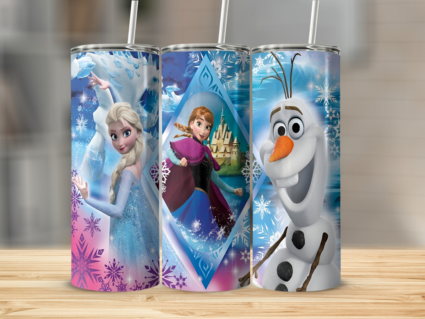 Three Frozen tumblers featuring Elsa, Anna, and Olaf against snowy backgrounds.