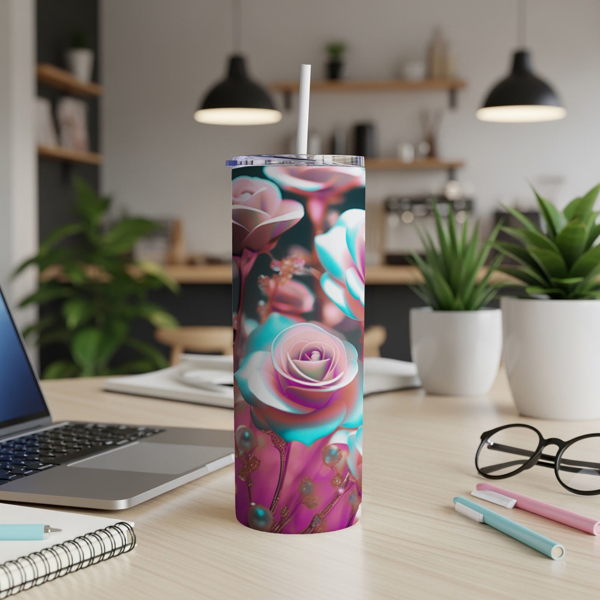 Tumbler with a floral rose design and metallic pink accents.