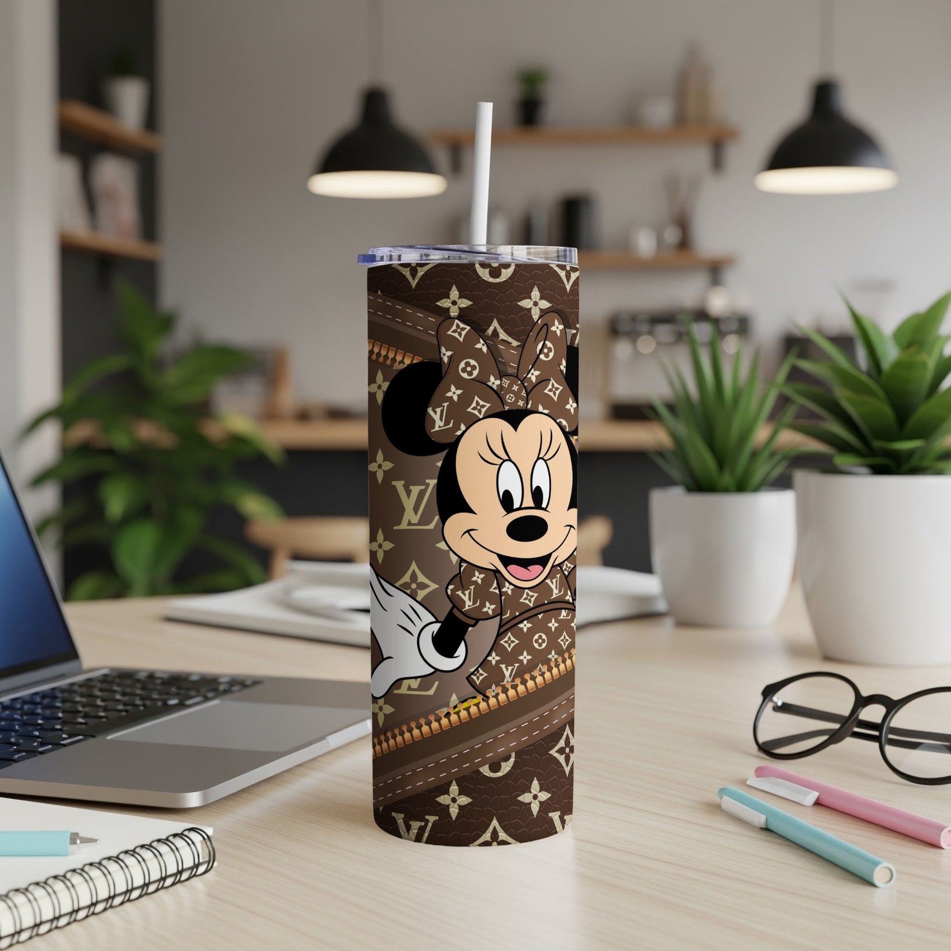 Minnie Mouse on a brown tumbler with repeating logo pattern.