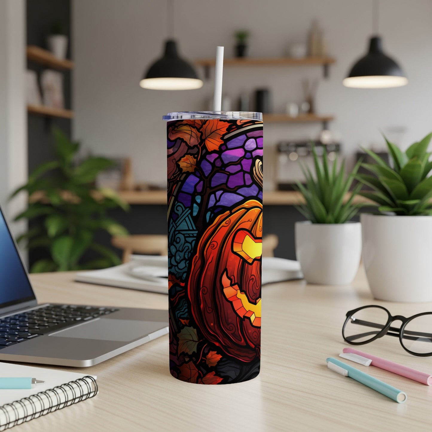 Tall tumbler with a carved Halloween pumpkin and fall leaves design.