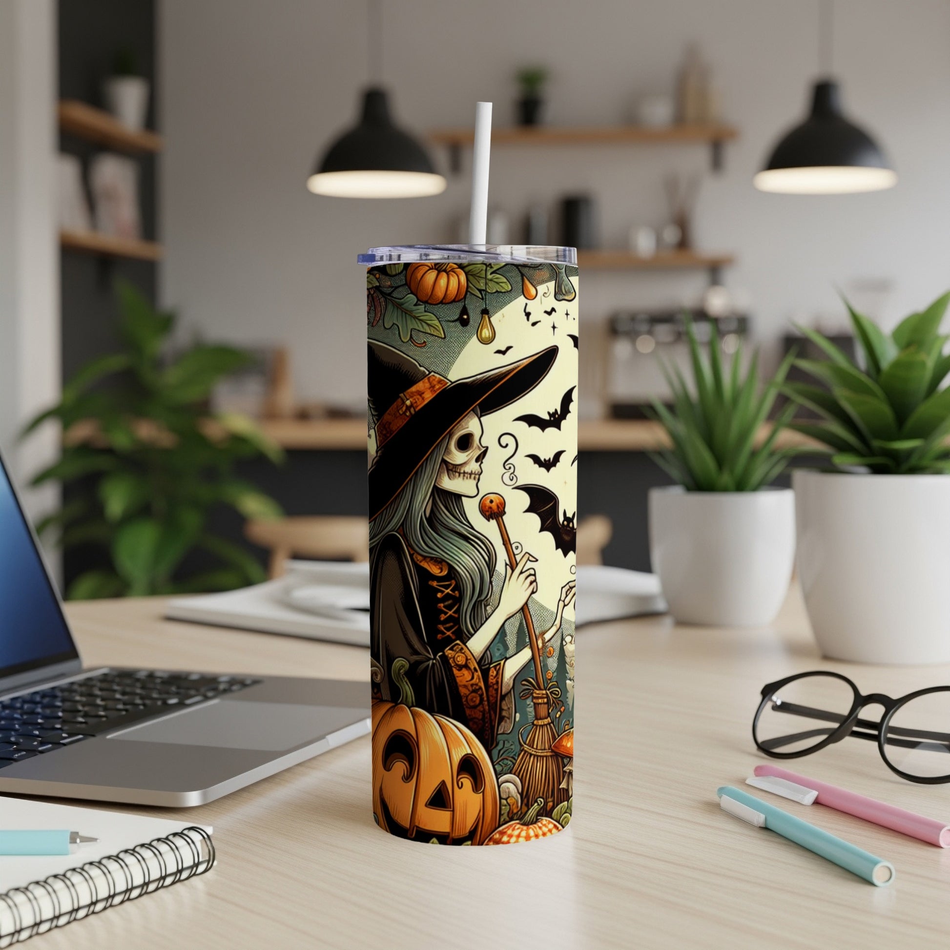 Halloween tumbler with witch, pumpkin, bats, and broomstick design.