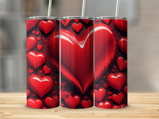 Three tumblers with a pattern of red hearts.
