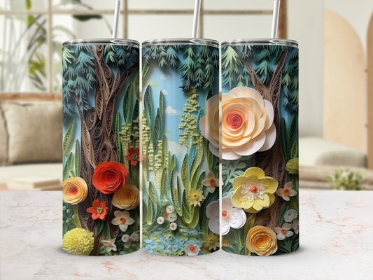 Three tumblers decorated with layered paper trees, flowers, and foliage.