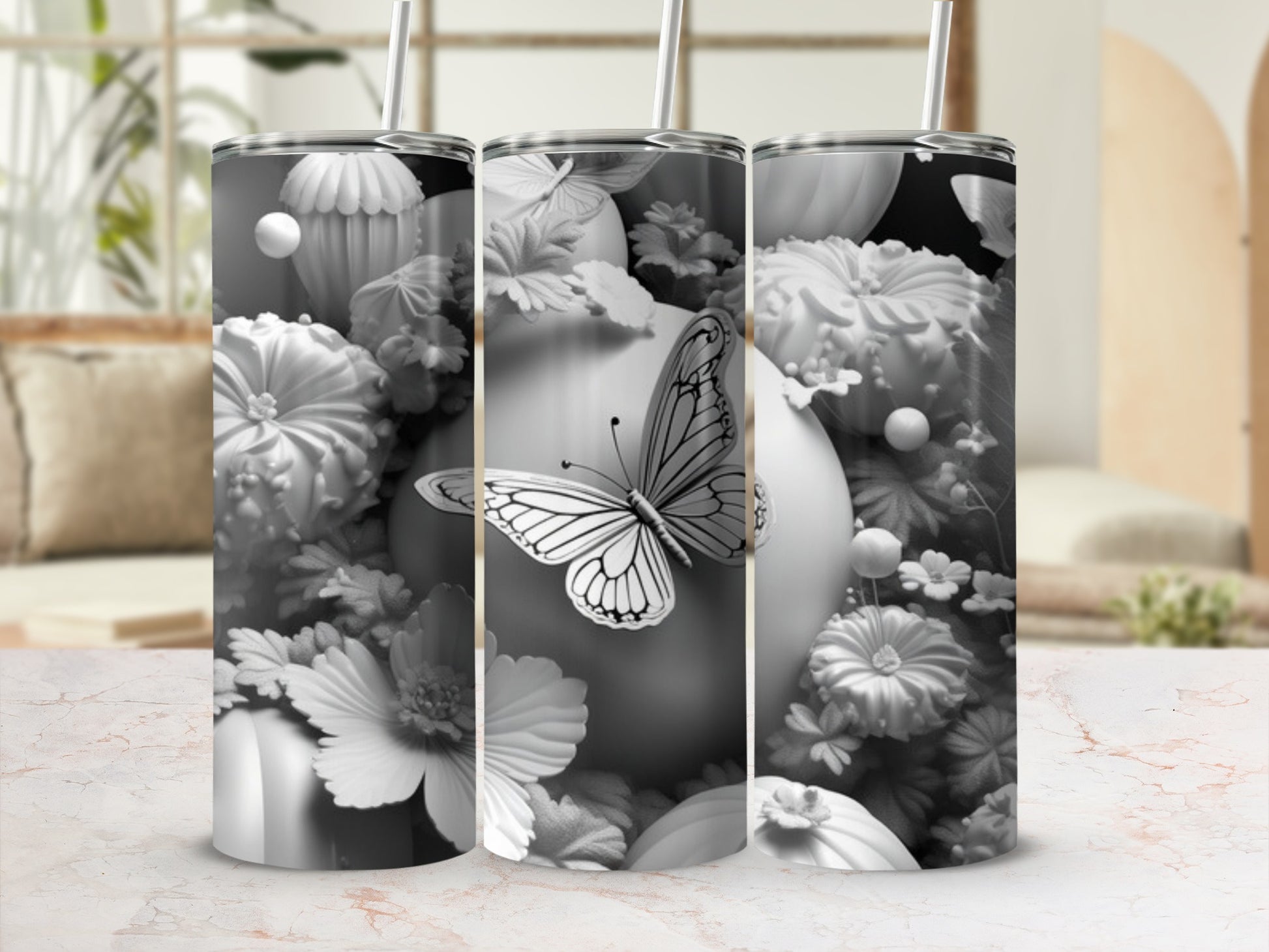 Black and white floral and butterfly pattern on a tumbler.