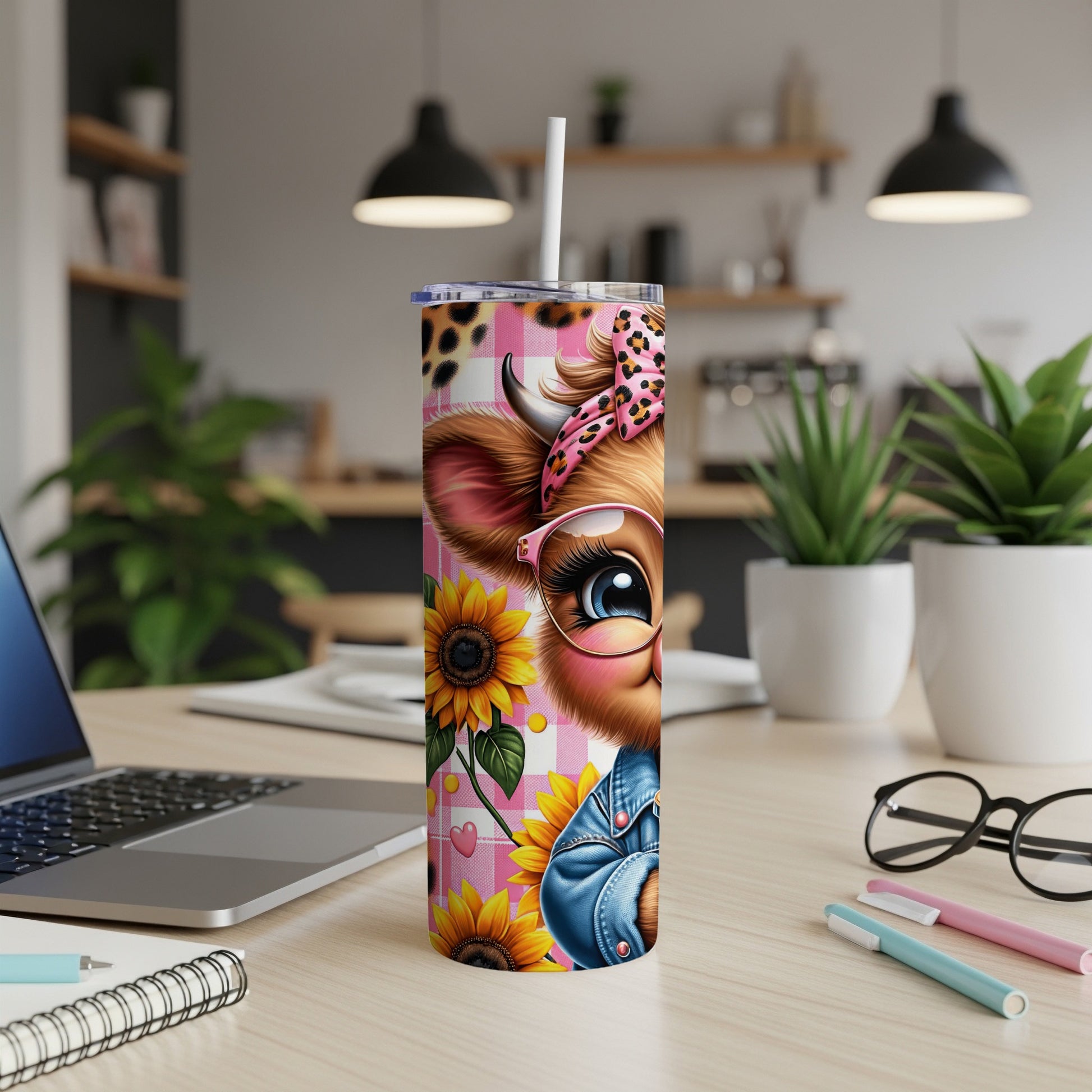 Pink leopard print tumbler with cartoon cow and sunflowers.