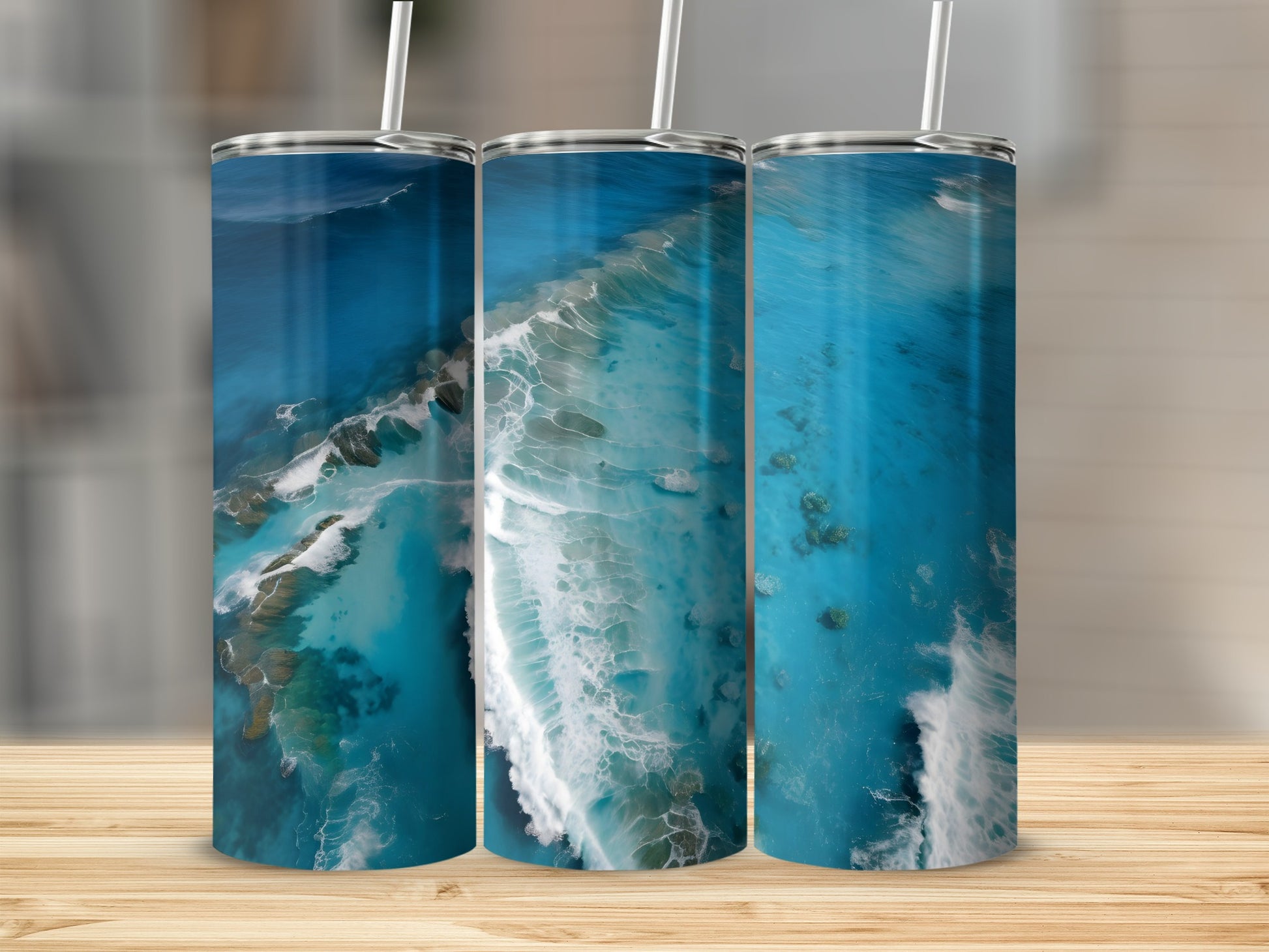 Three tumblers with a blue ocean and white wave pattern.
