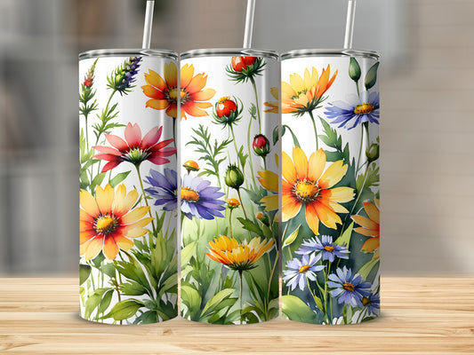 Three tumblers decorated with colorful wildflowers and green leaves.