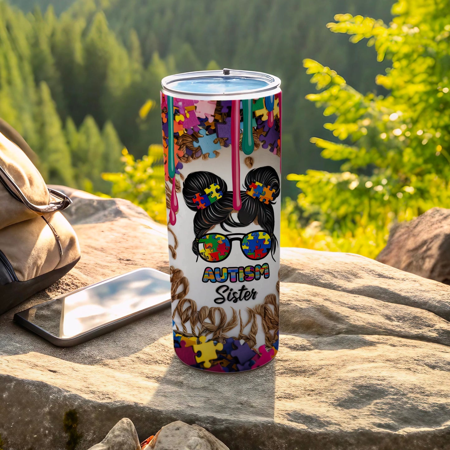 Autism Sister tumbler with puzzle piece pattern and graphic of a girl.