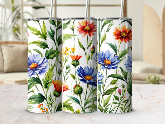 Tumbler with a watercolor floral pattern featuring blue, orange, and yellow flowers.