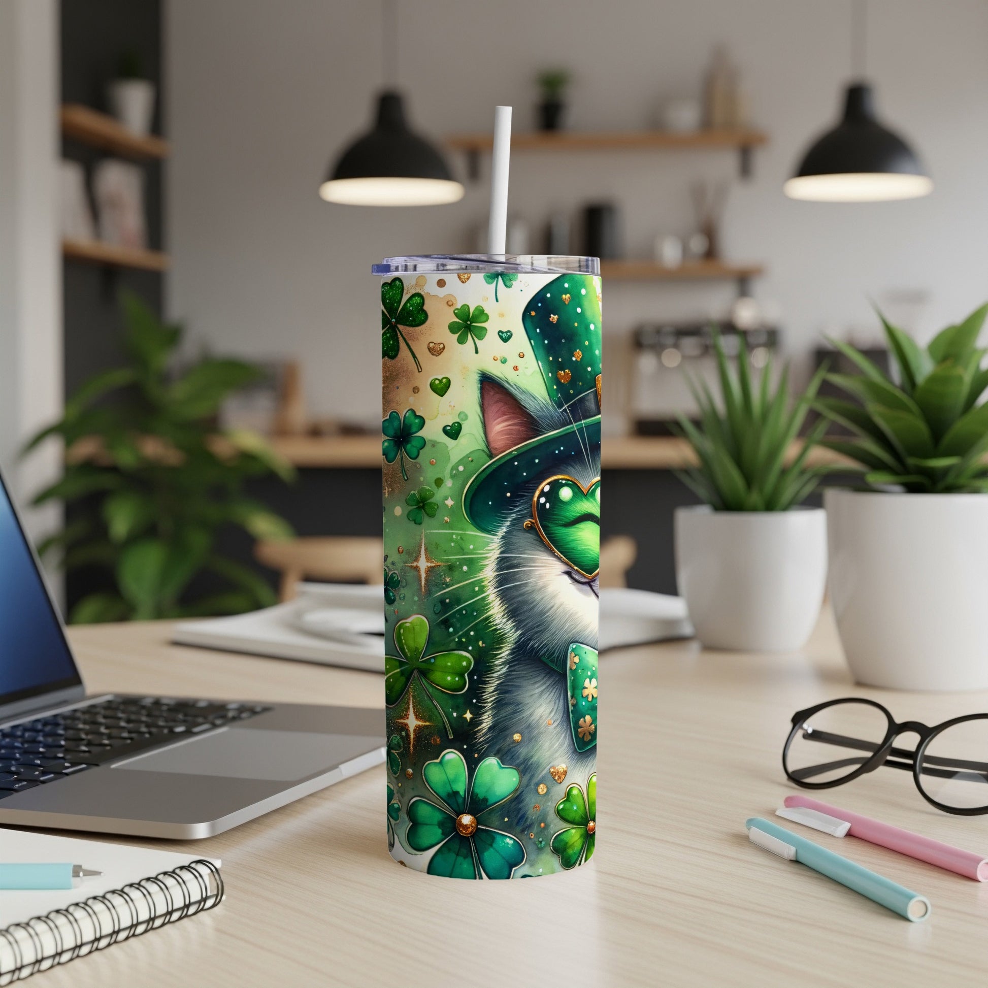 Green cat wearing a hat and glasses with shamrocks on a tumbler.