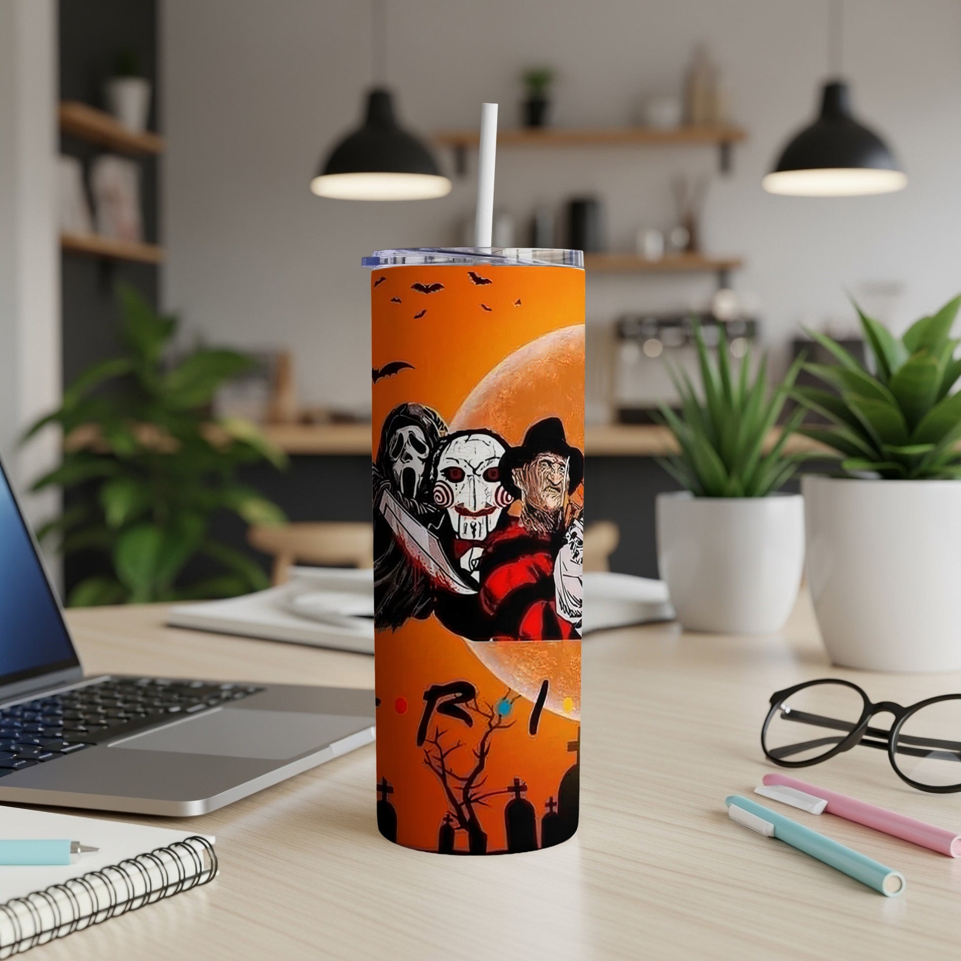 Tall tumbler with horror characters and Halloween scene.