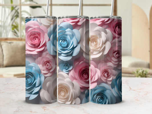 Three tumblers adorned with pink, blue, and cream paper roses.
