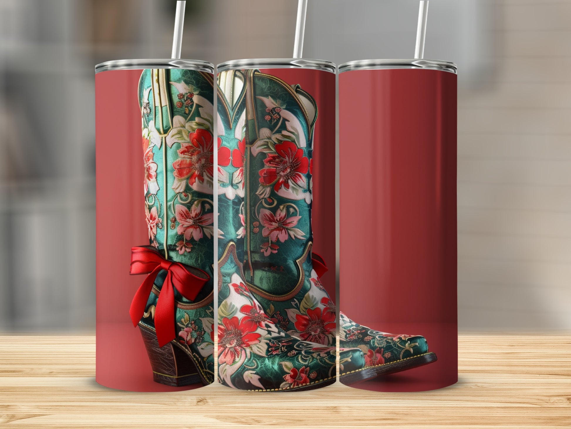 Green floral cowboy boots with red bow, displayed as tumblers.