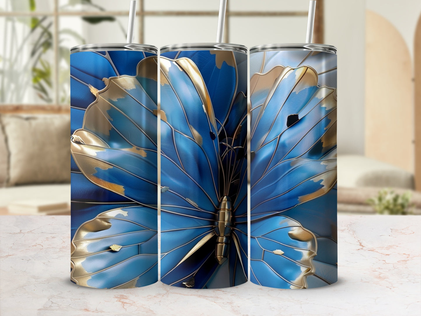 Three tumblers featuring a blue and gold butterfly design.