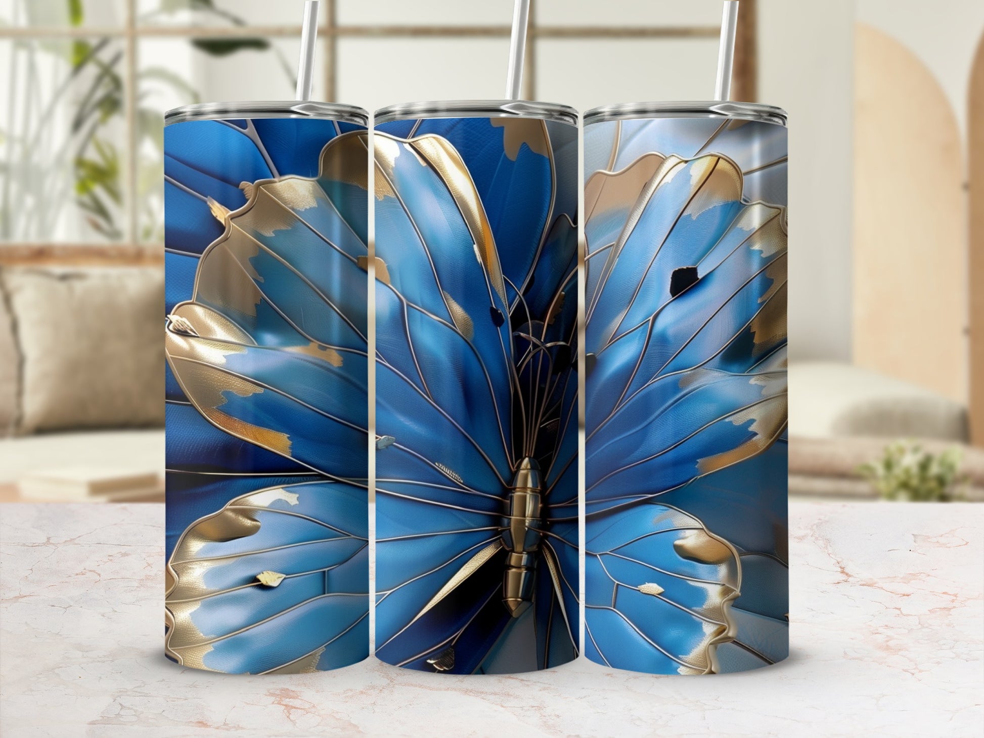 Three tumblers featuring a blue and gold butterfly design.