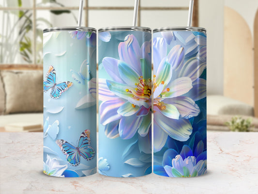 Three tumblers with watercolor butterflies and large blue and white flowers.