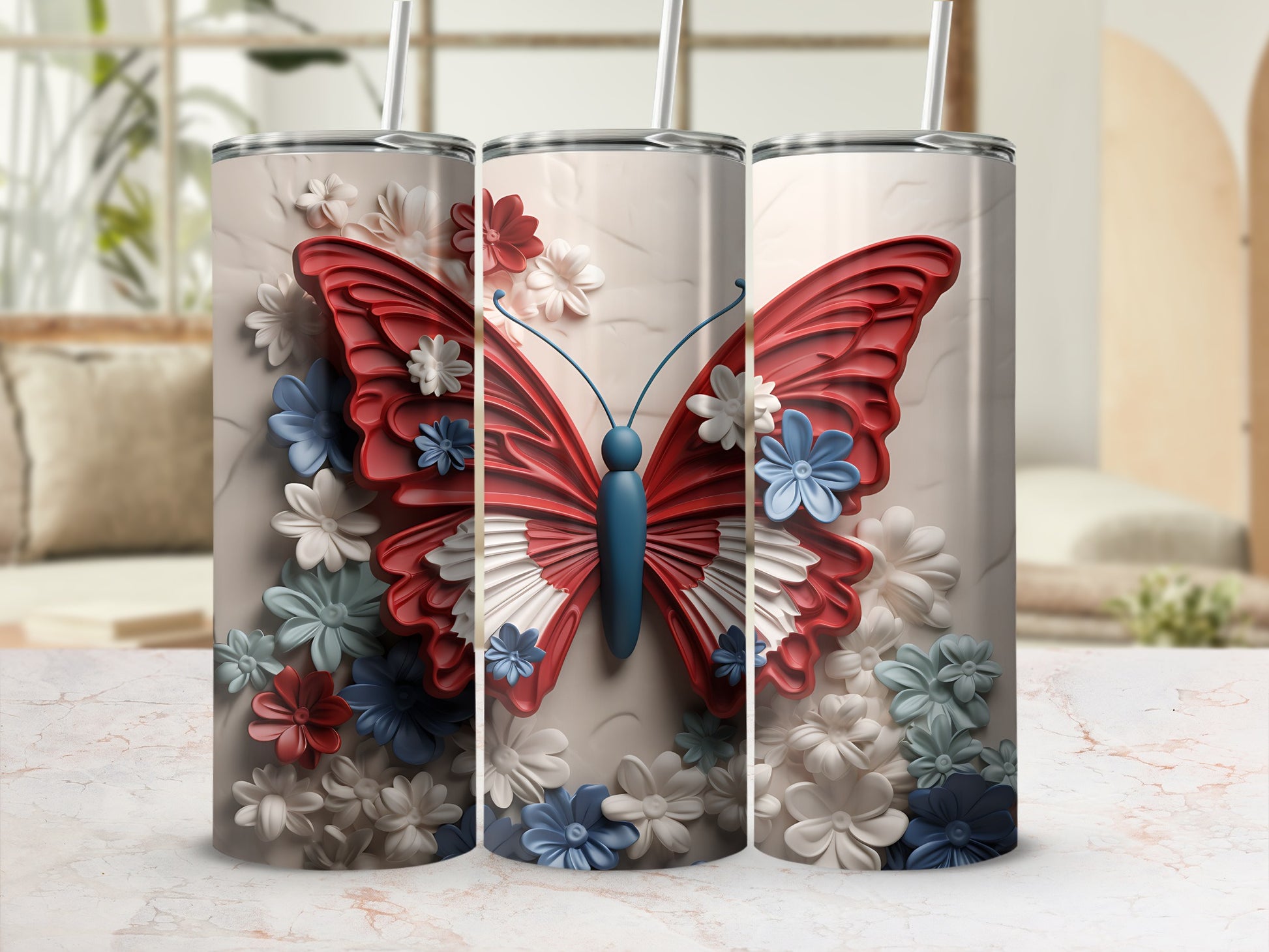 Three tumblers with a raised red butterfly and floral design.
