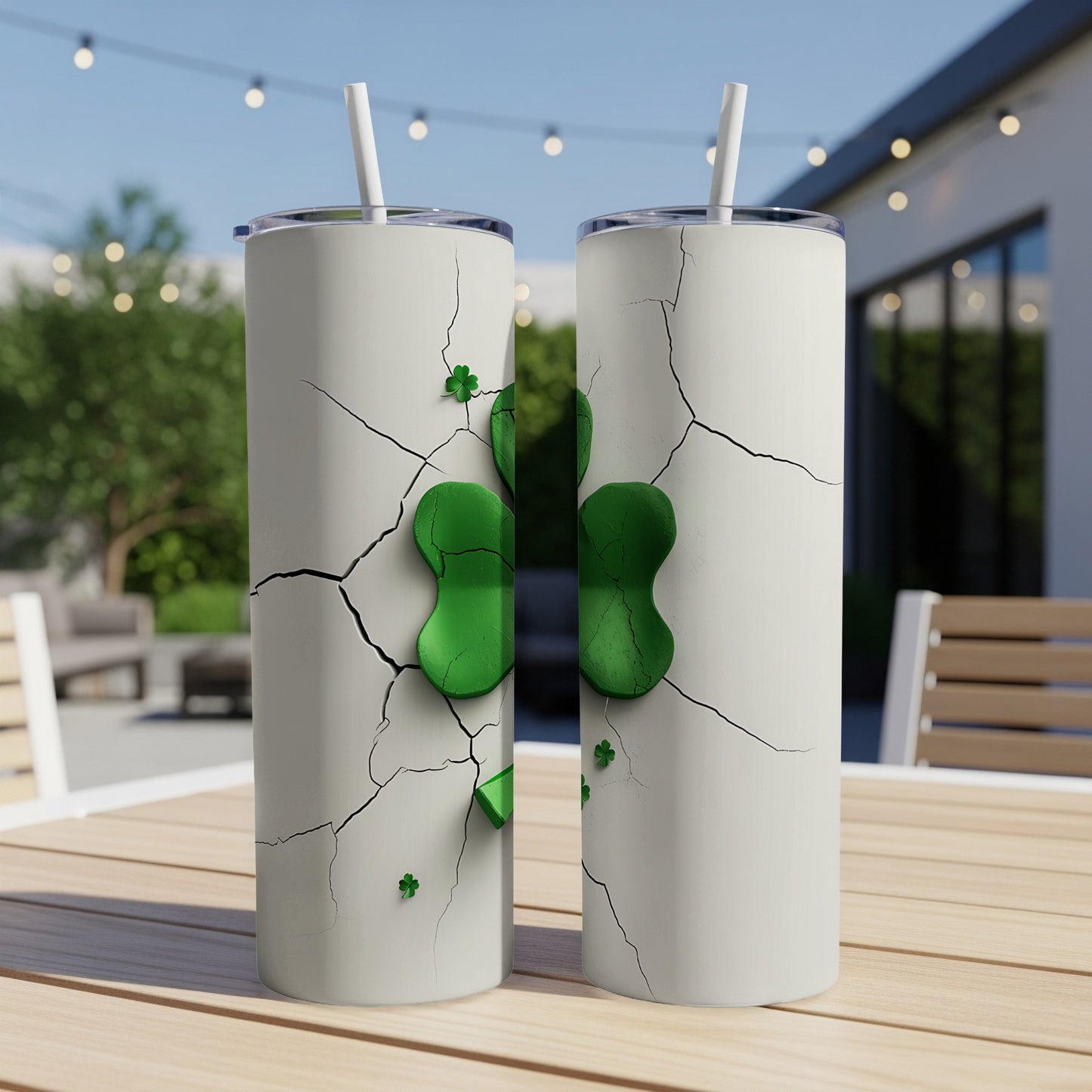 Two white tumblers with a cracked design and green shamrock detail.
