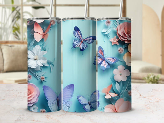 Three blue tumblers with butterflies and floral designs.