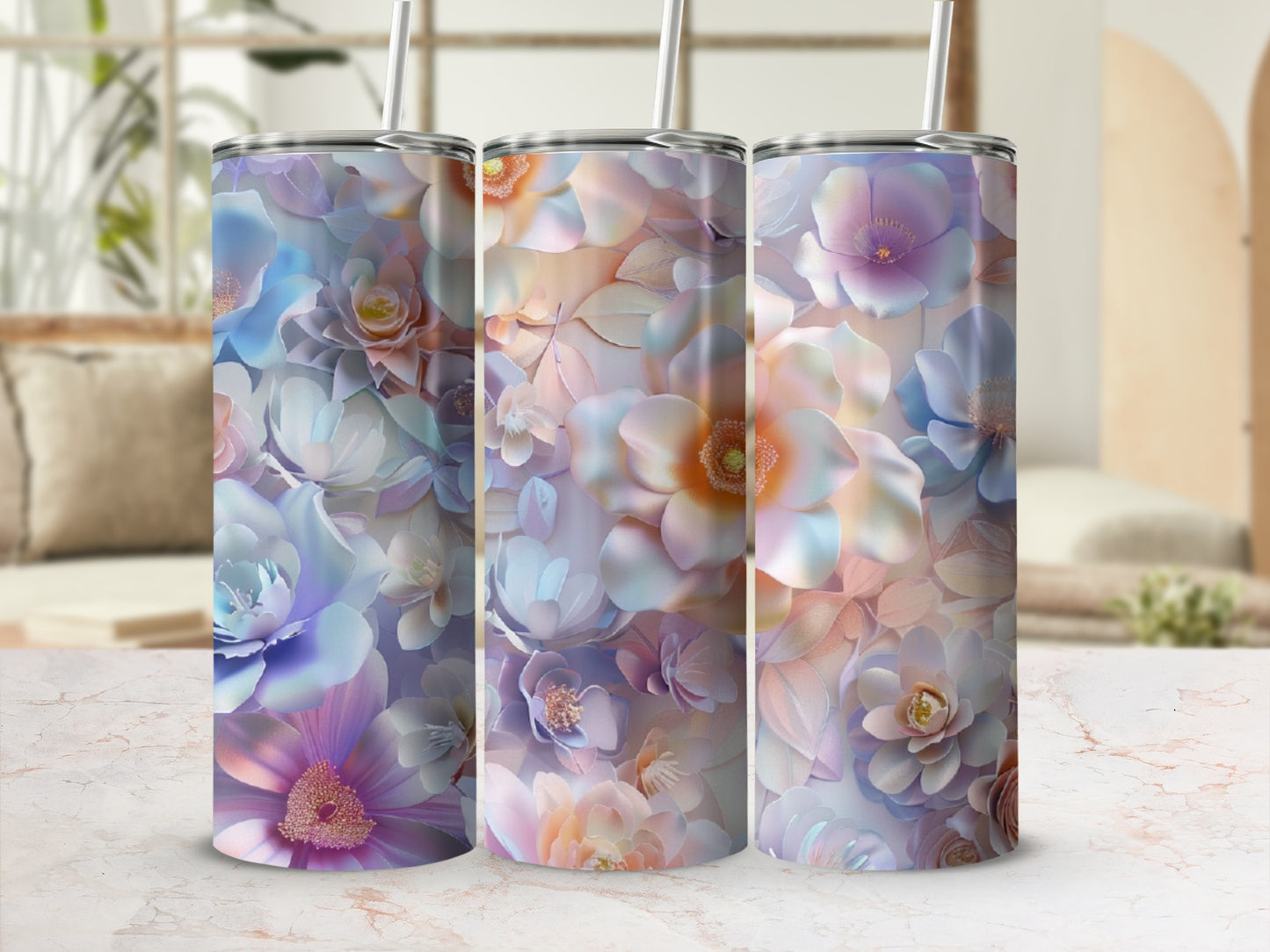 Three tumblers with floral patterns in shades of purple, blue, and peach.