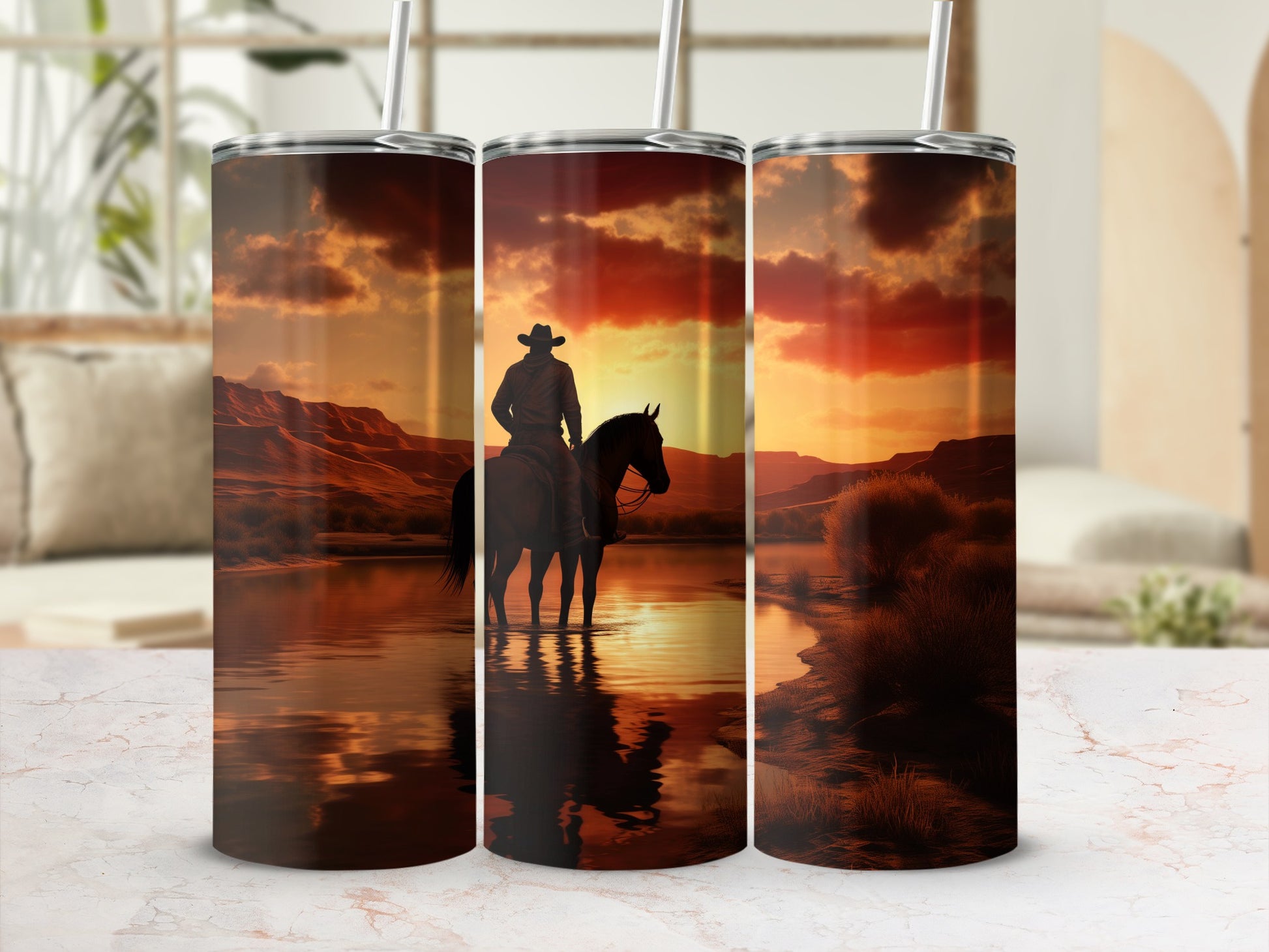 Three tumblers featuring a cowboy on horseback at sunset in a desert landscape.