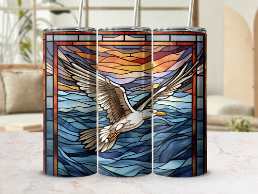 Seagull in flight over stained glass ocean waves on a tumbler.