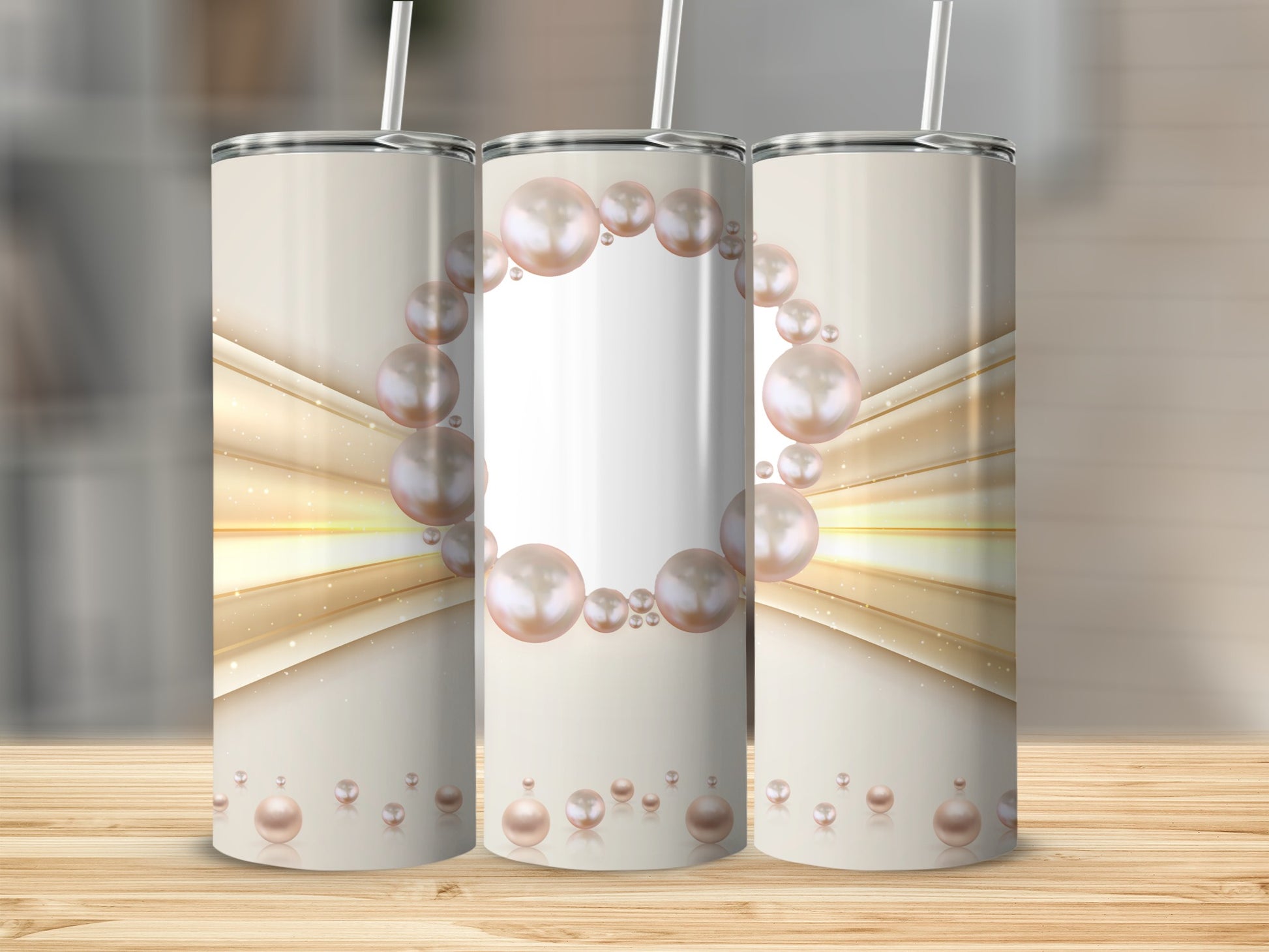 Three tumblers with pearl and golden light abstract design.