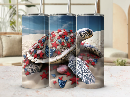 Tumbler with a sea turtle decorated with red and blue stars on sand.