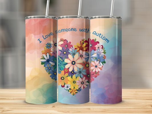 Three tumblers with a heart made of colorful flowers and "I love someone with autism" text.