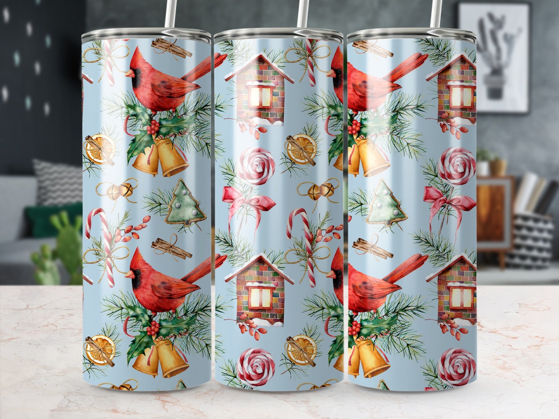 Cardinal and Christmas ornament pattern on a blue tumbler with straw.