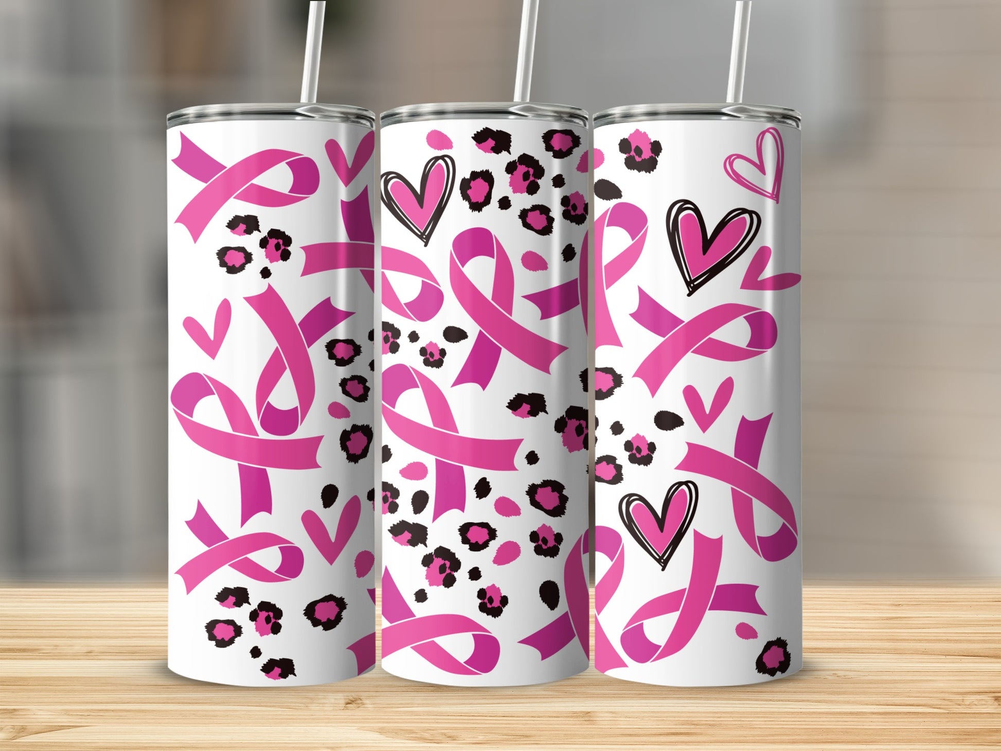 Pink breast cancer ribbons and hearts on leopard print tumbler.