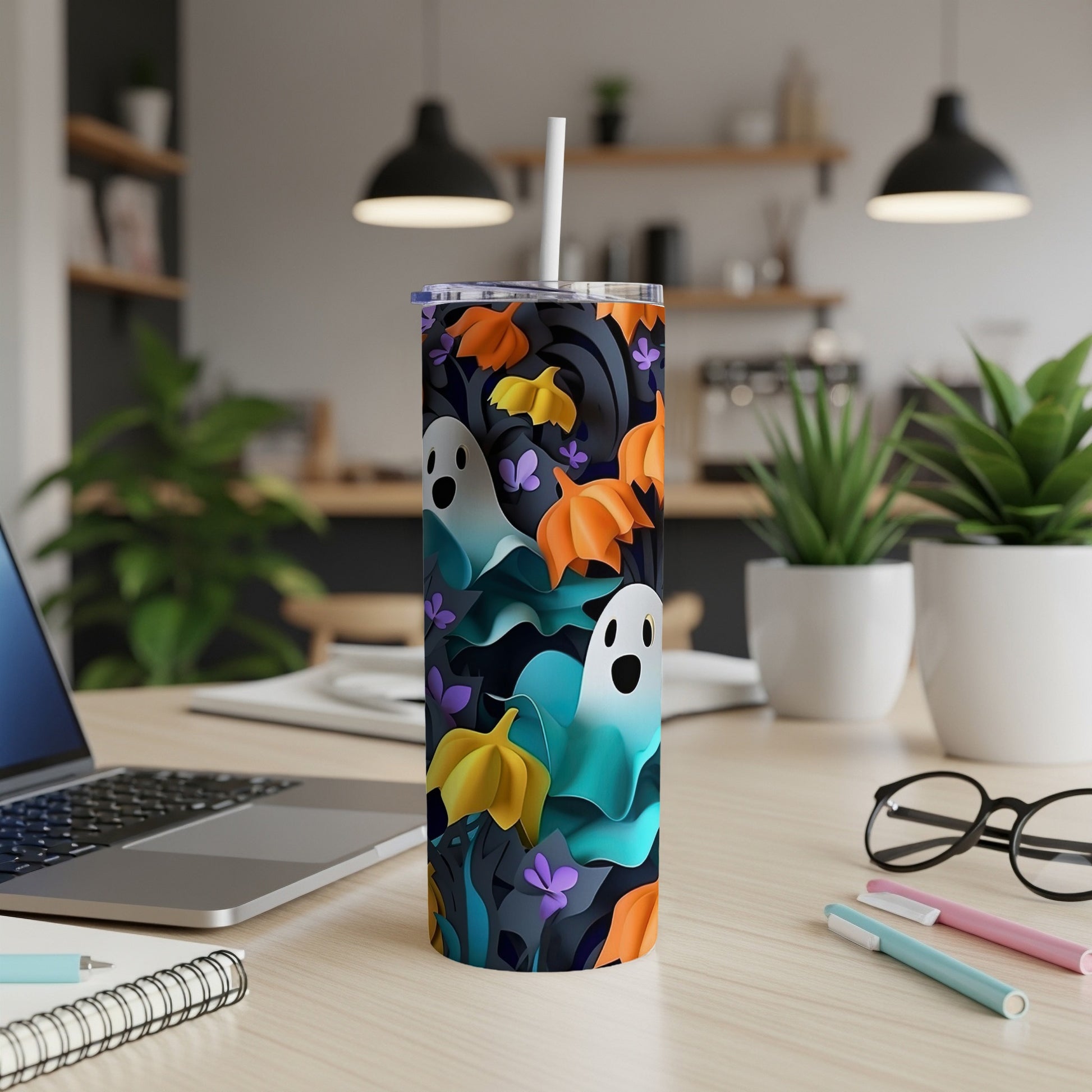 Tall tumbler with Halloween ghosts, pumpkins, and floral pattern.