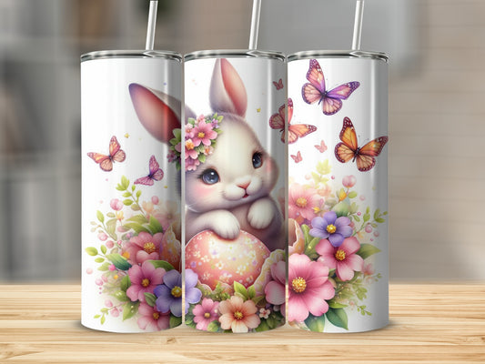 Easter bunny with butterflies and flowers on a pastel egg.