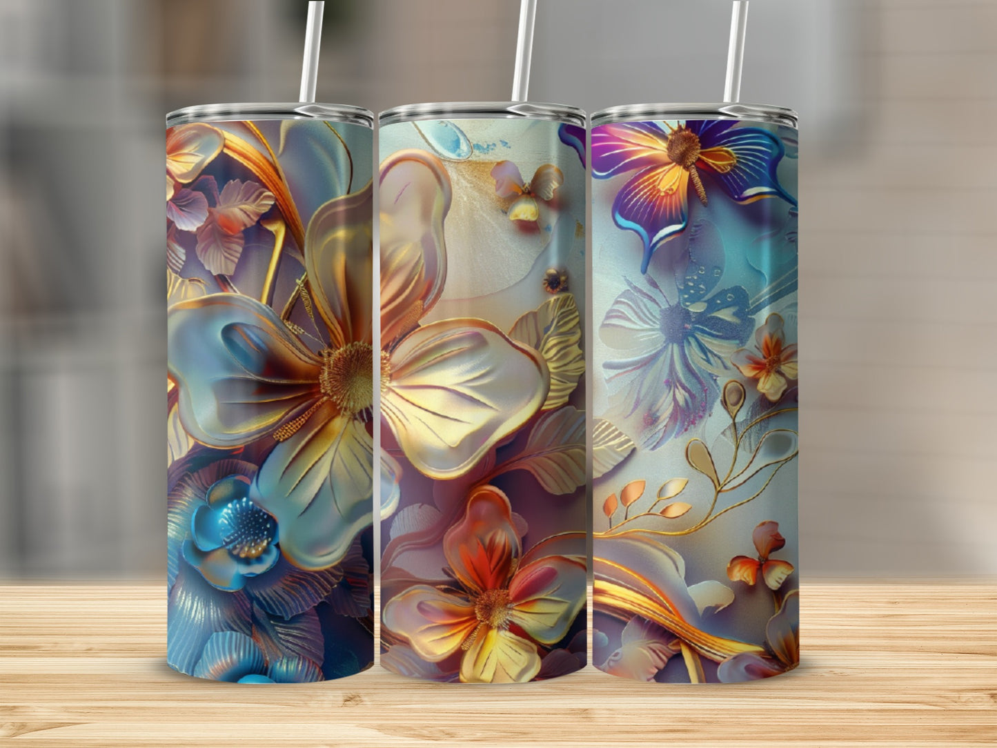 Three floral tumblers with iridescent petals and gold accents on a wooden surface.