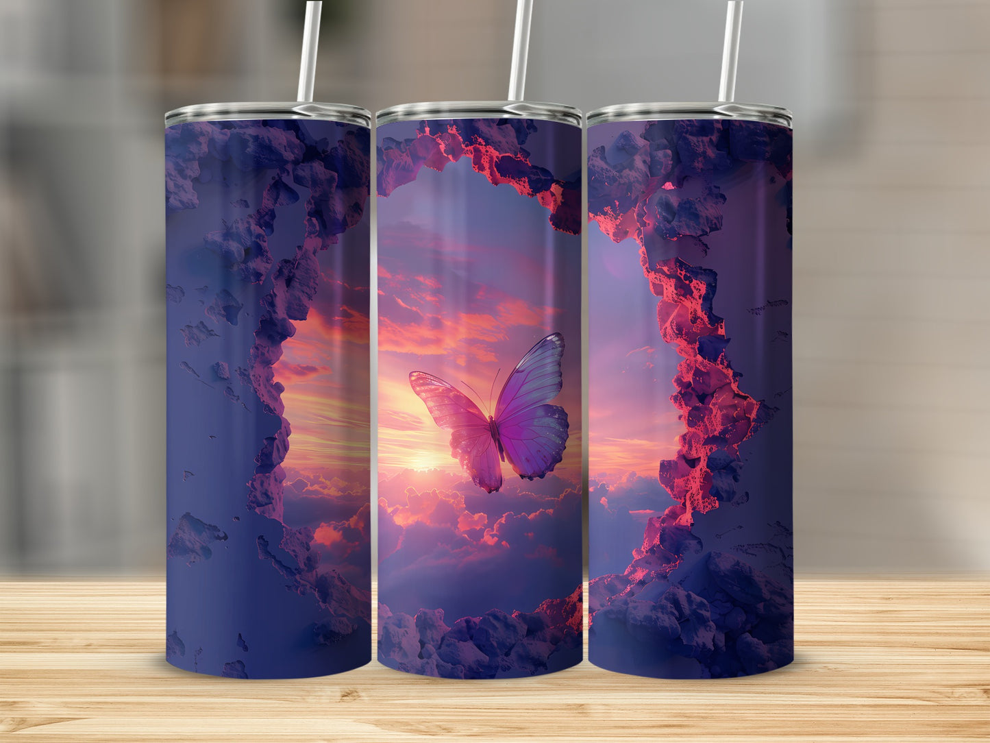 Three tumblers featuring a pink butterfly in a sunset sky with clouds.