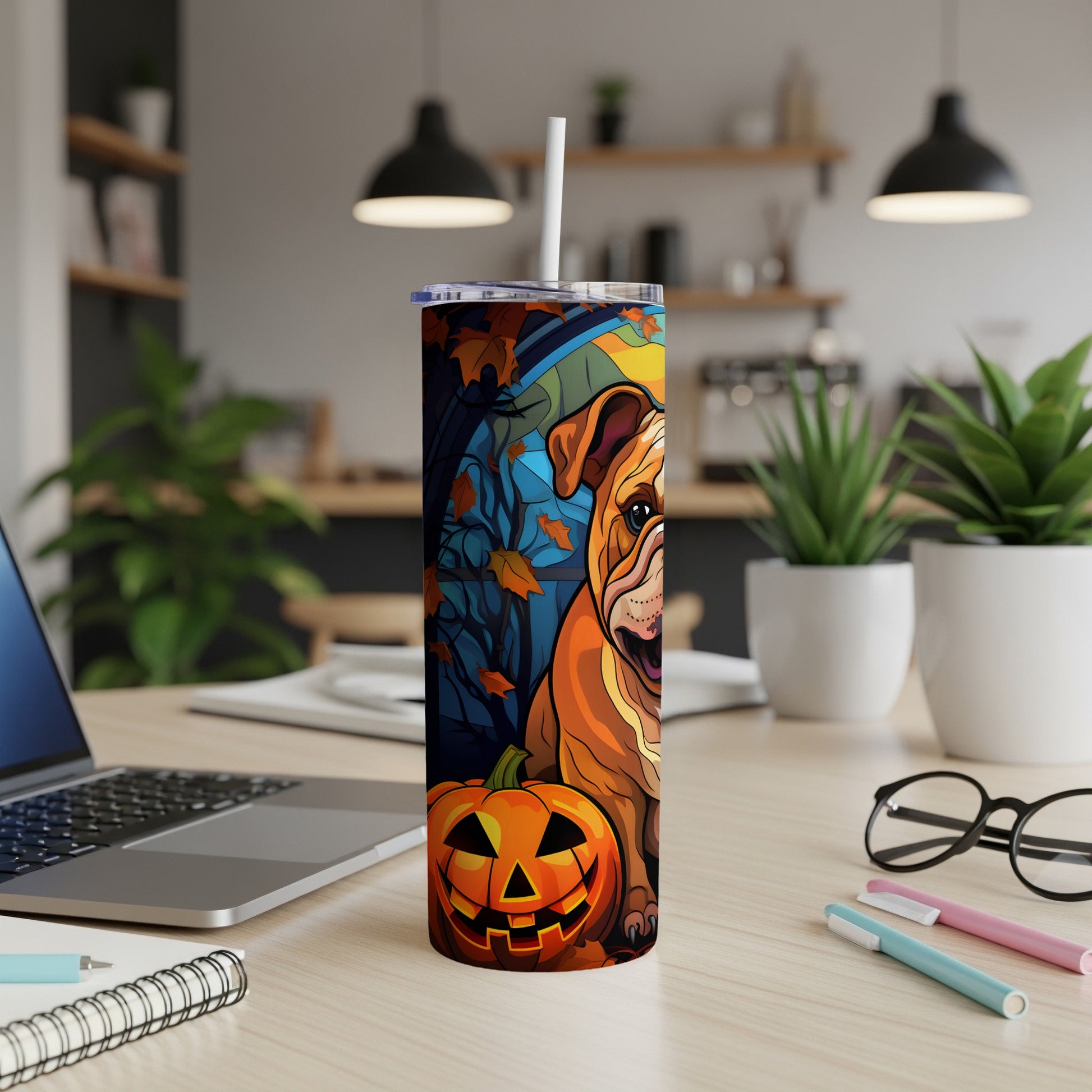 Bulldog and jack-o'-lantern Halloween tumbler with leaves and a dark background.