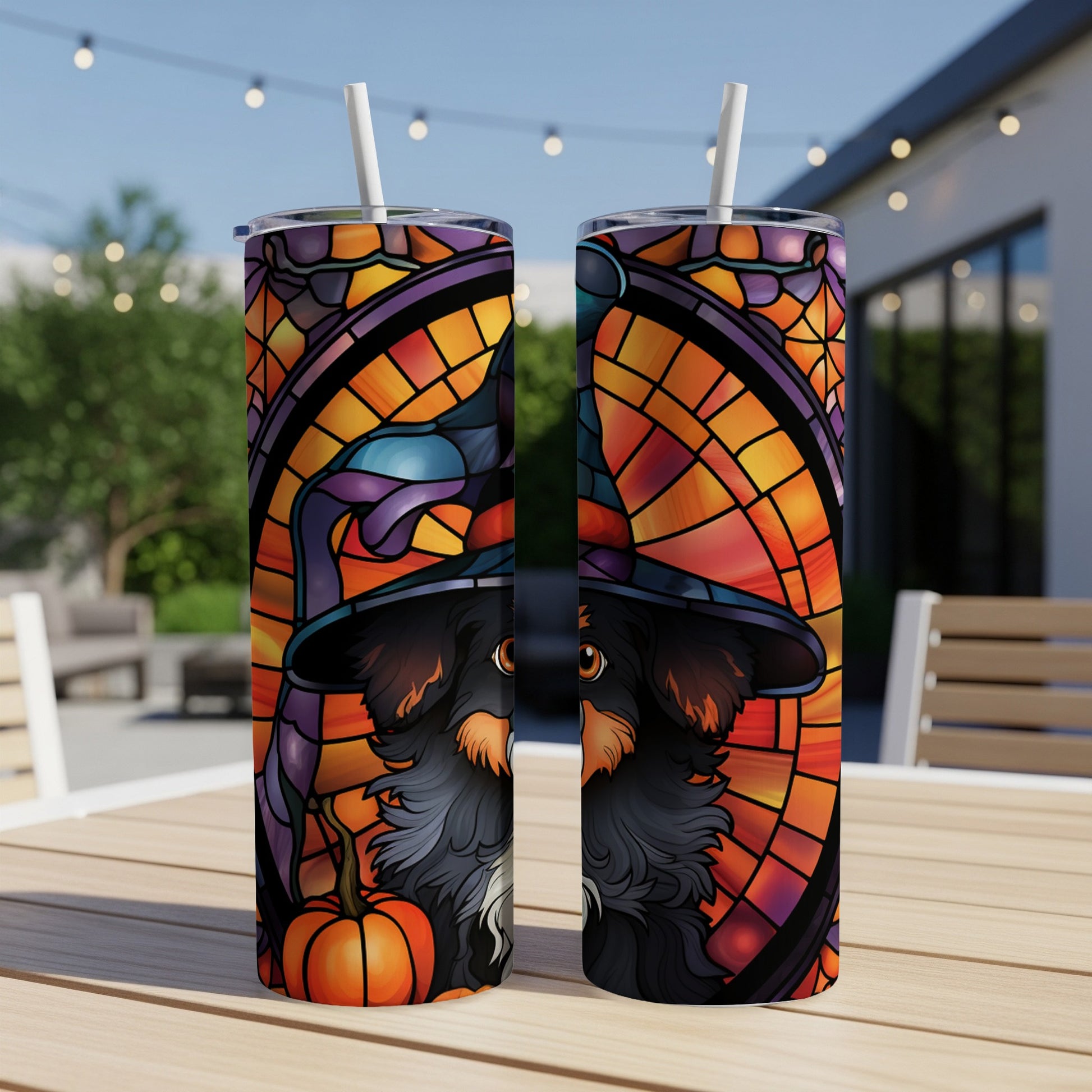 Two Halloween-themed tumblers with a witch hat-wearing dog and stained glass design.