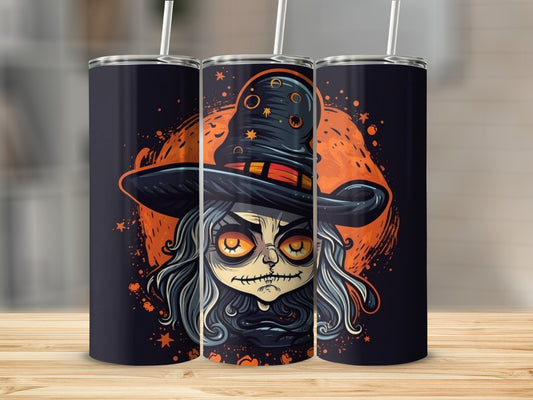 Three tumblers with spooky witch cartoon art and straws on a wooden surface.