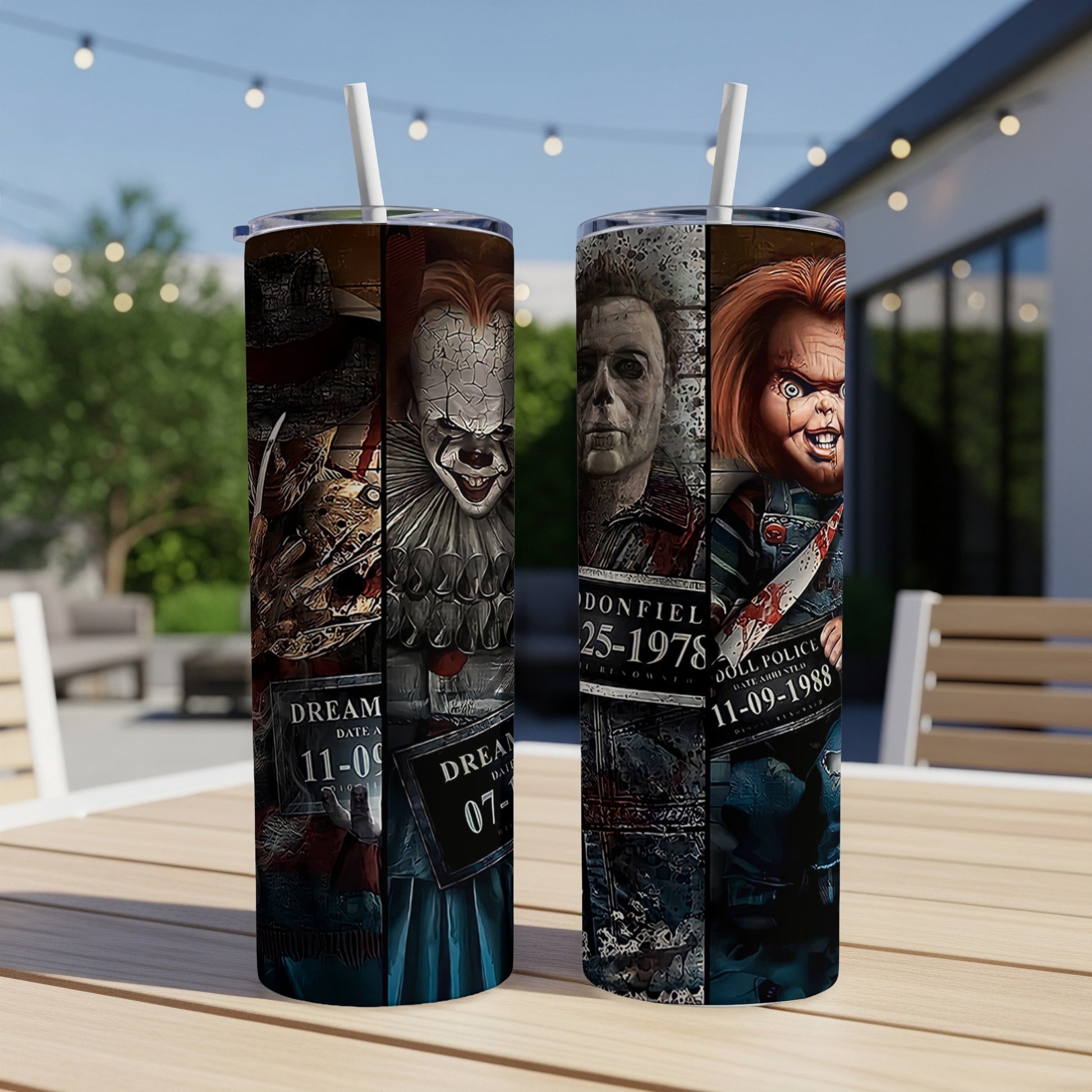 Horror movie characters on two tumblers with straws, set on a table.