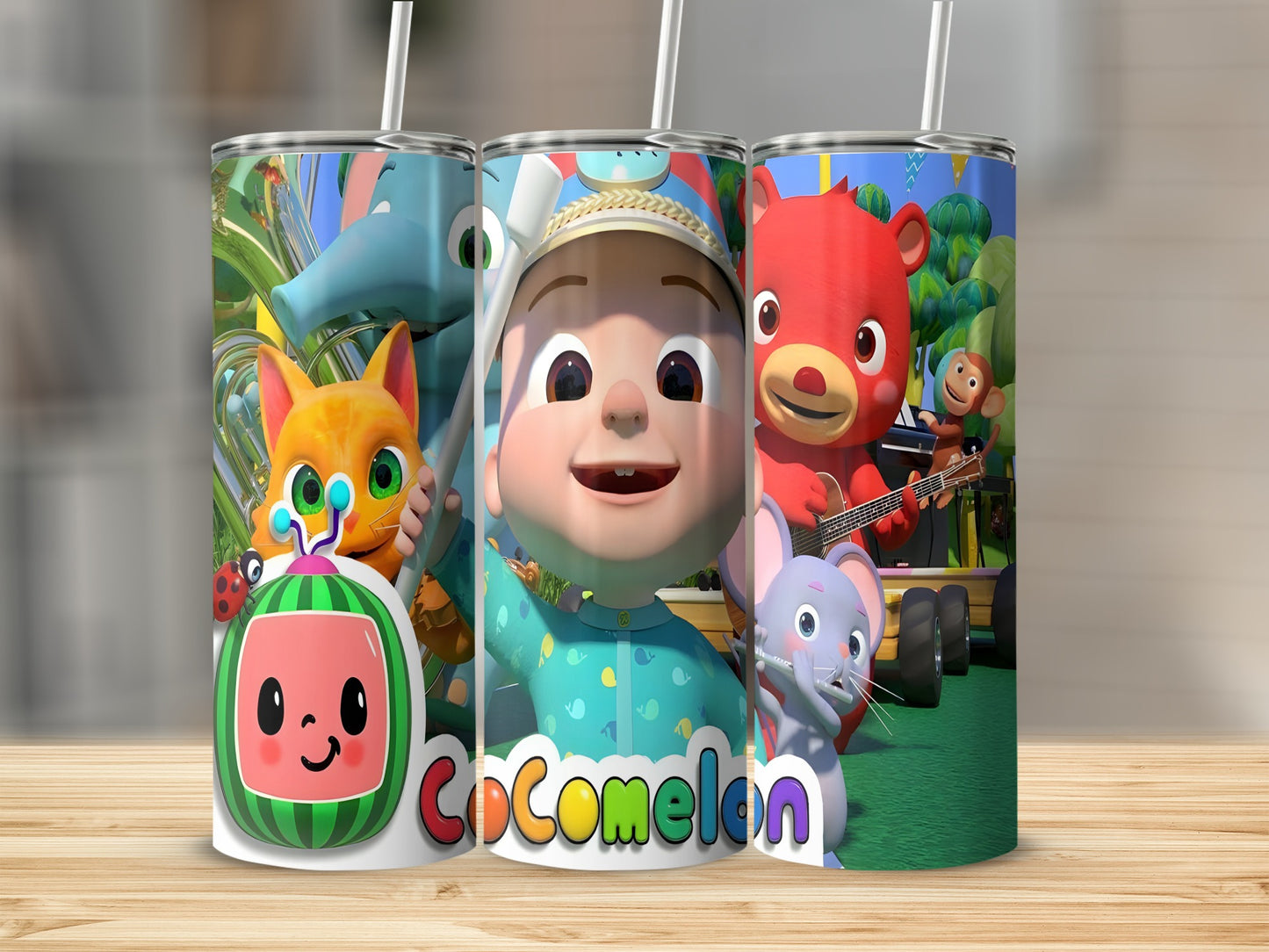 Cocomelon characters JJ, Cody, and a red bear on a tumbler.
