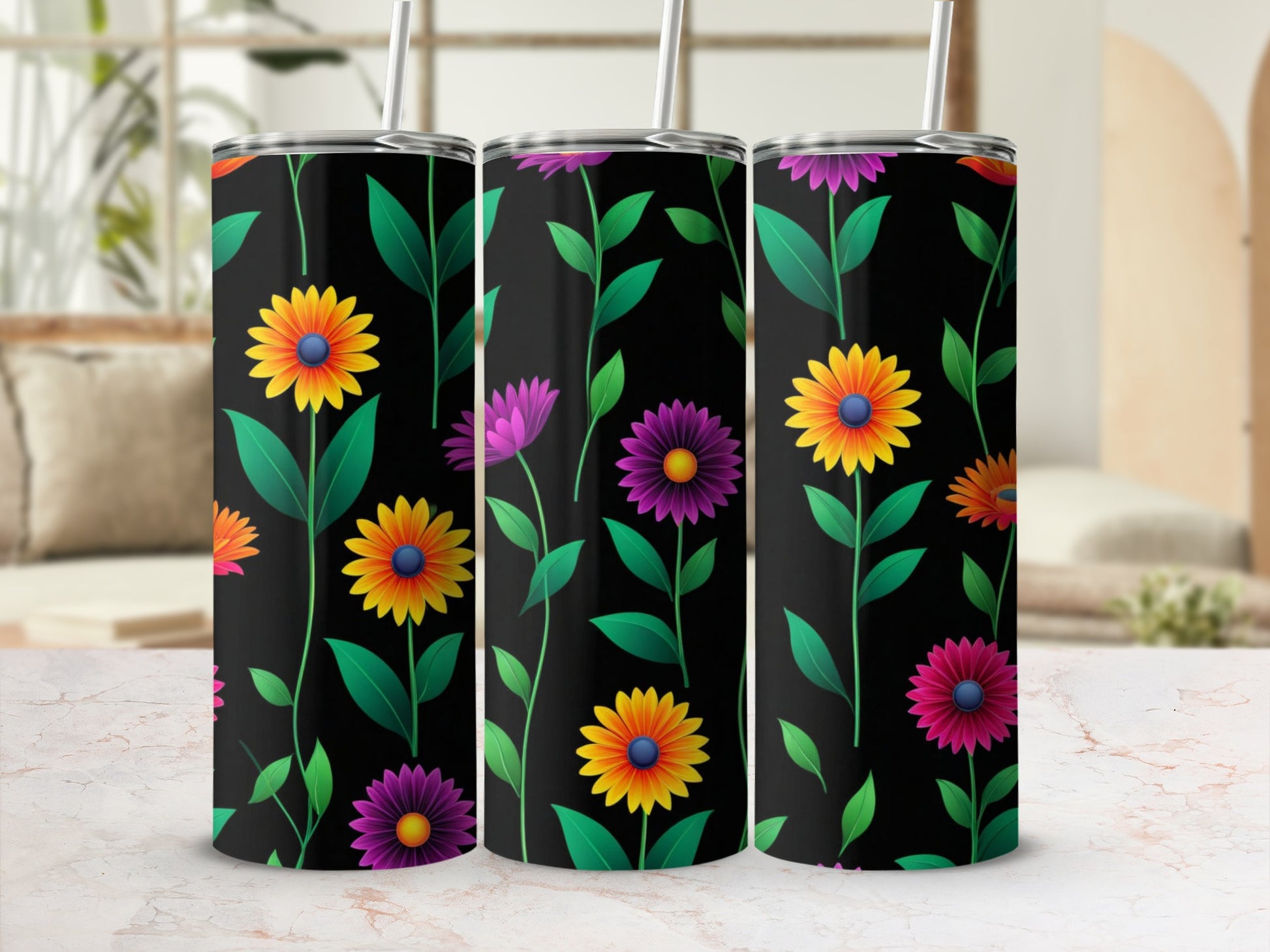 Three tumblers with a black background and colorful floral pattern.