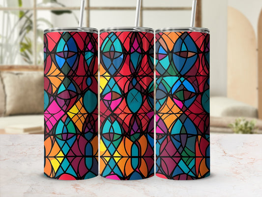 Three tumblers with a colorful stained-glass pattern on a marble countertop.