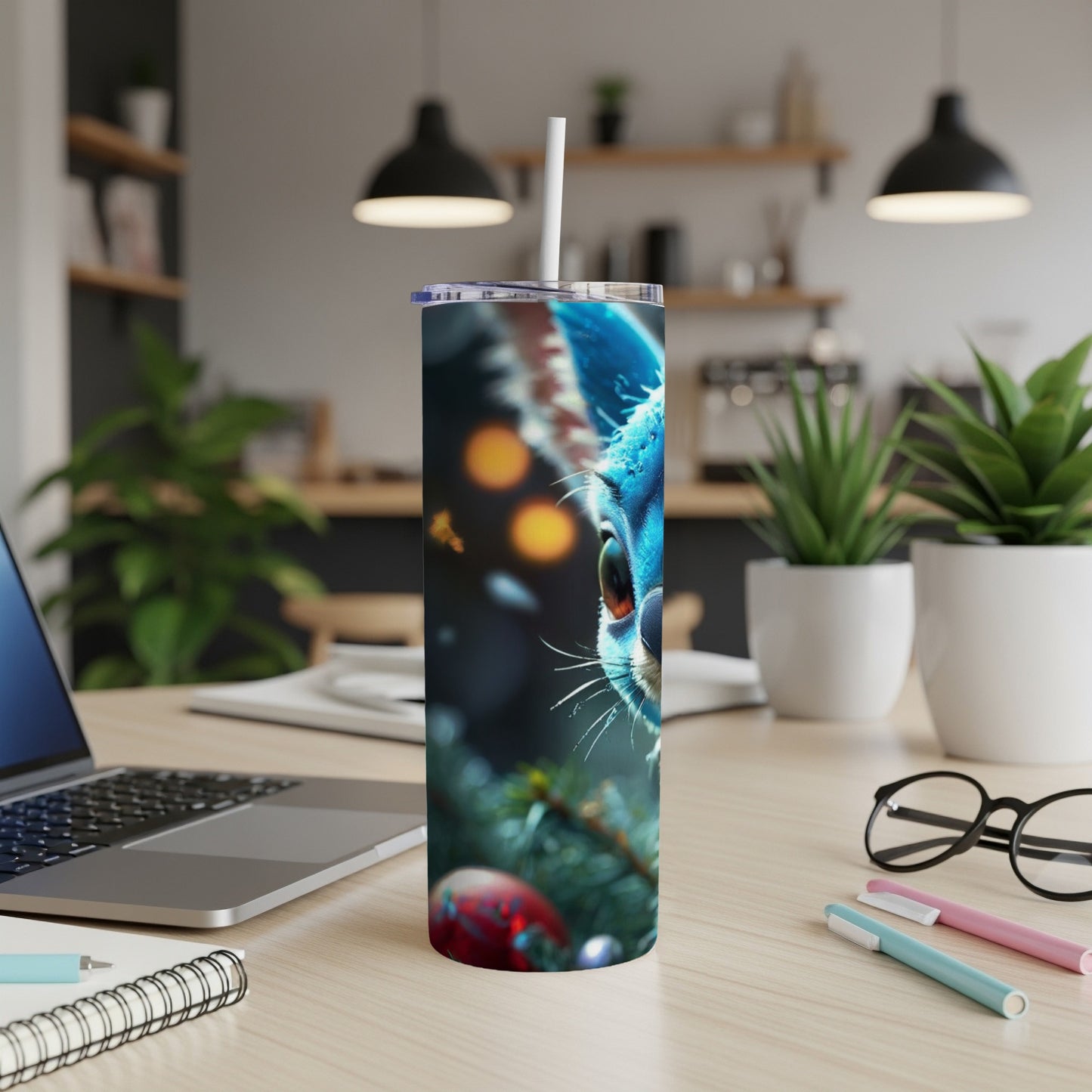 Blue and white striped tumbler with a cat's face design.
