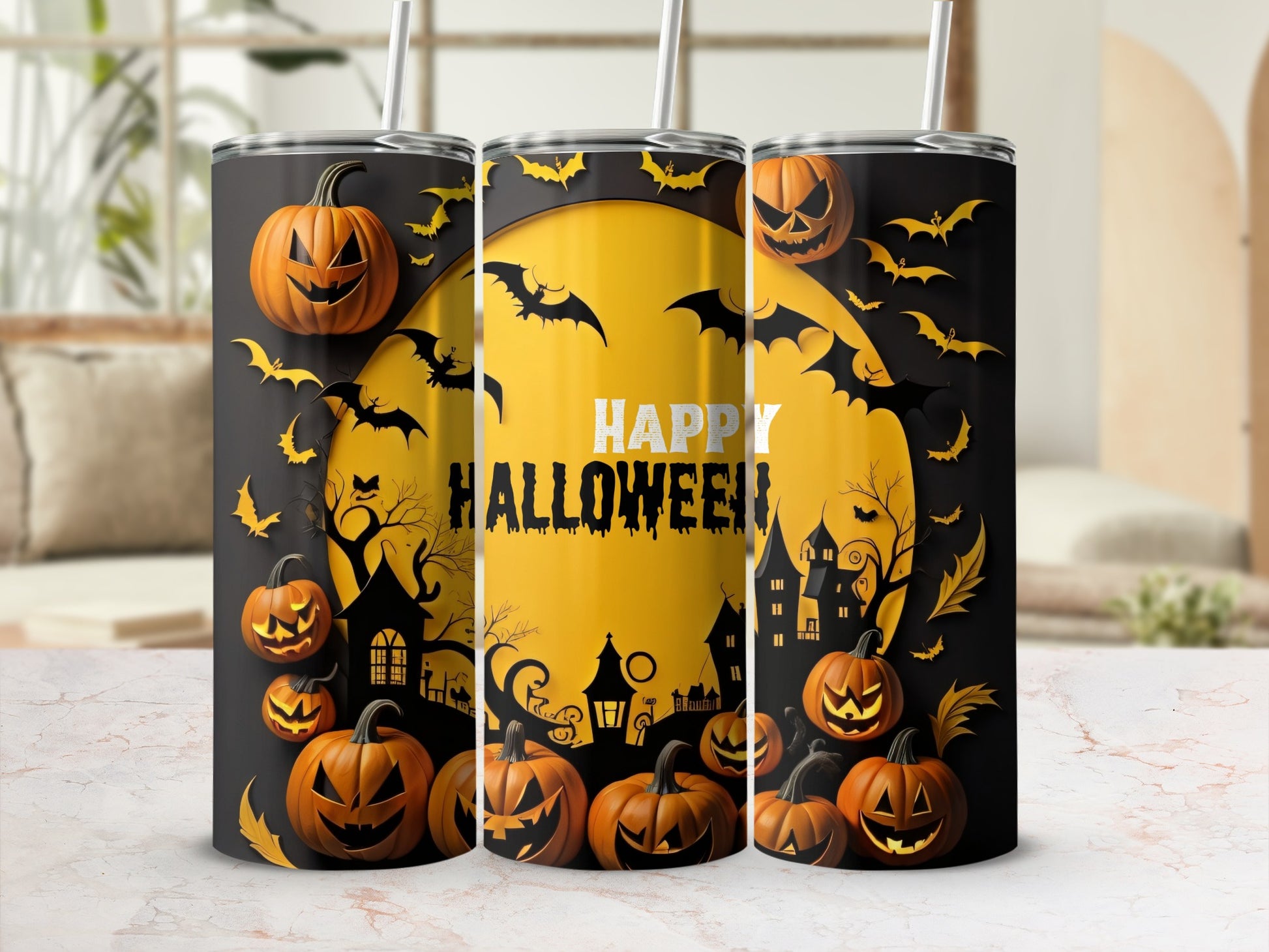 Three tumblers with a Halloween theme, featuring pumpkins, bats, and haunted houses.